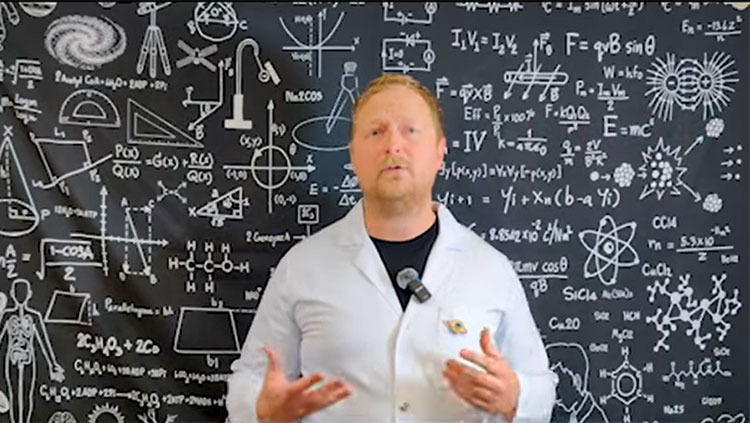 Man standing in front of equations