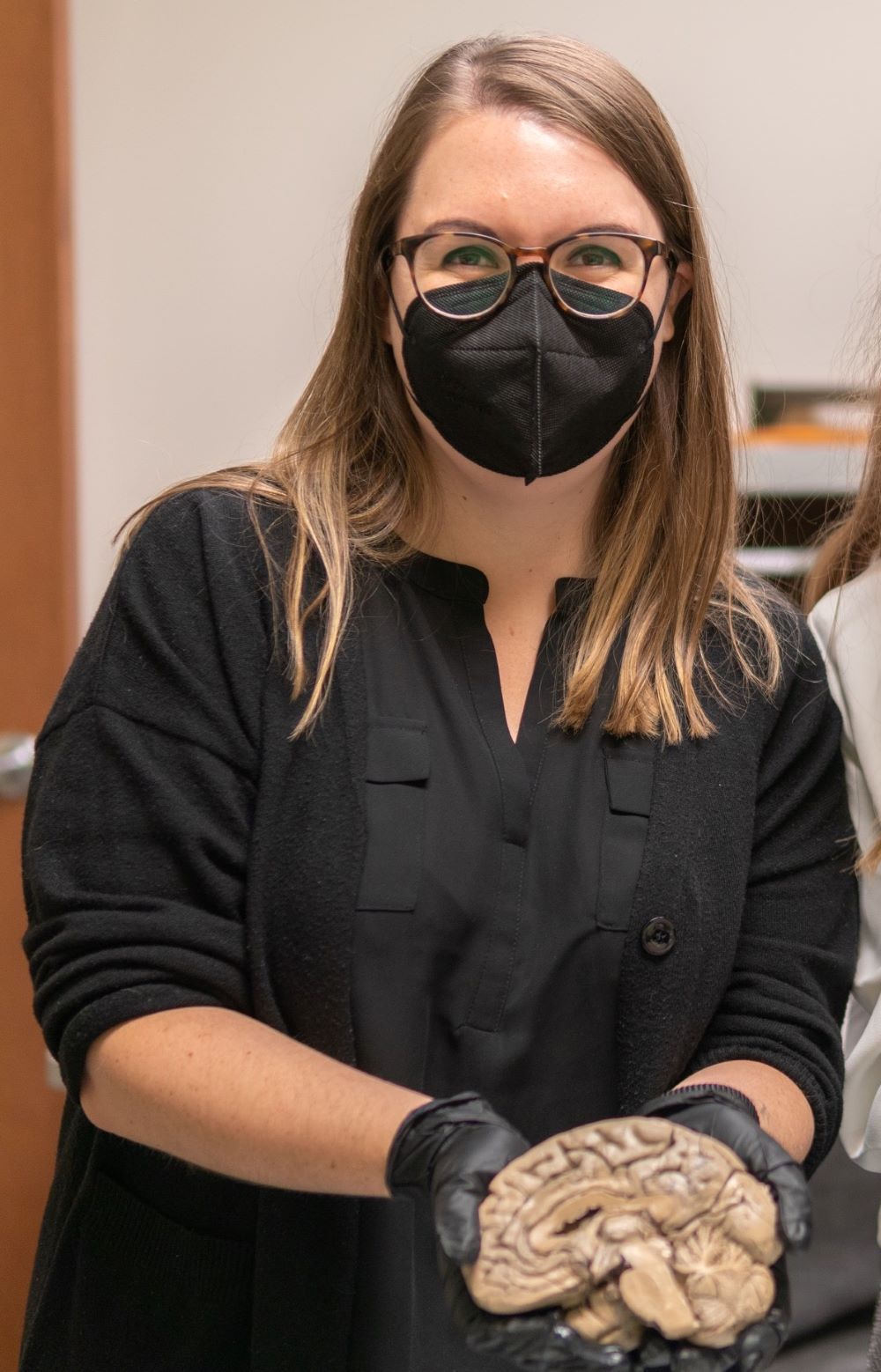 Clara holding a brain photo