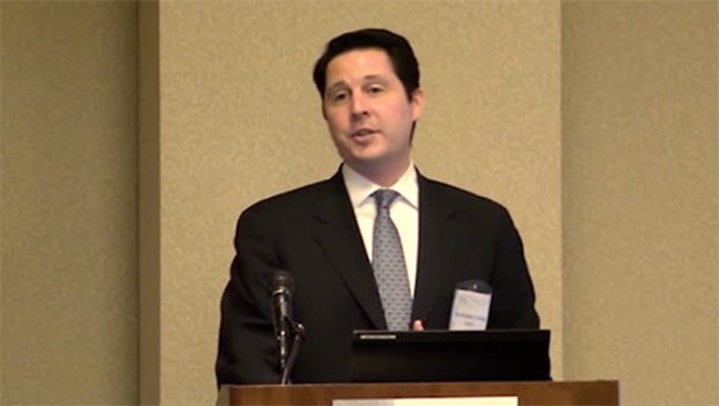 Christopher Tobias, PhD giving a speech at SfN's annual meeting.