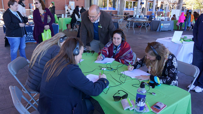 Luke Kramer, executive director of mental health advocacy group The STARR Coalition, led attendees in an audio simulation of schizophrenia.