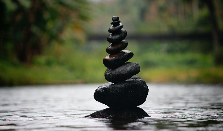 Black Stackable Stone Decor at the Body of Water - Photo by Nandhu Kumar