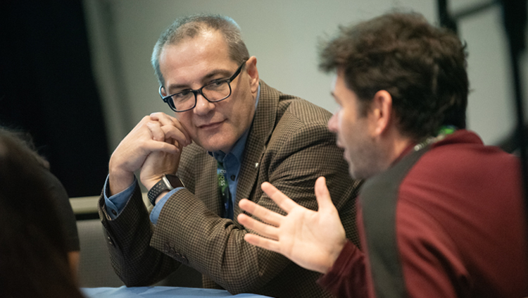 two men talking at SfN's annual meeting