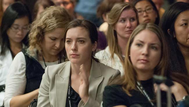 A group of female neuroscientists listening to a seminar.