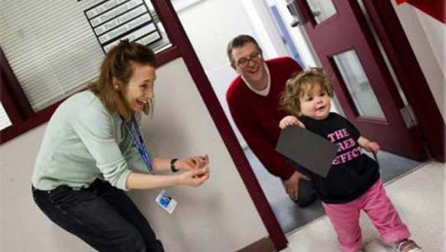 Sheena Josselyn with her family in the lab. 