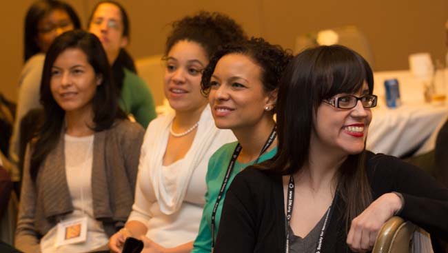 A group of female neuroscientists attend a luncheon. 