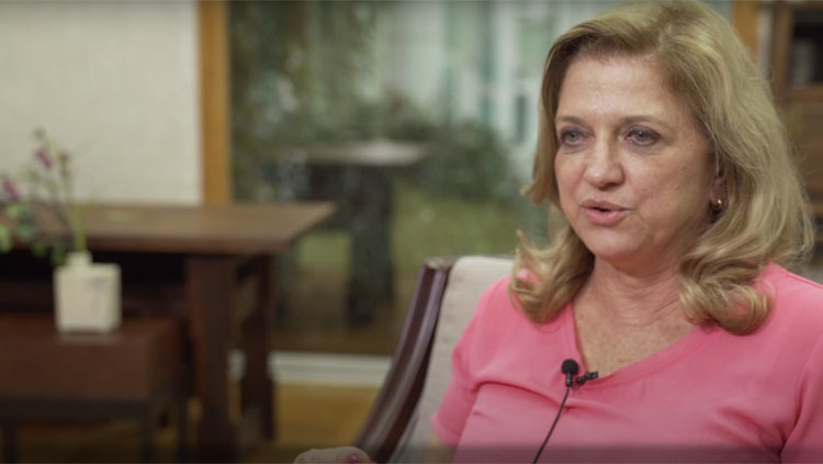 Image of Elaine Del Bel talking to the camera.