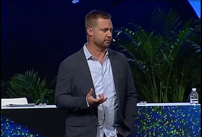 An image of Bryan Voltaggio speaking at an event.