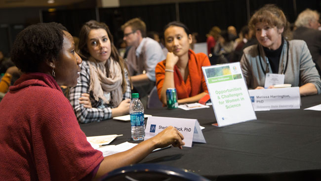 A group of female neuroscientists discuss career development. 