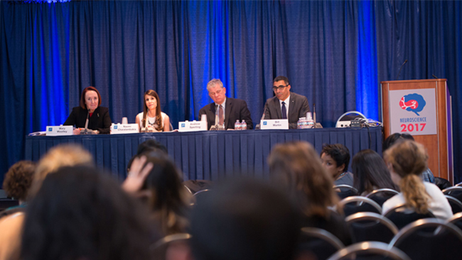 Four panelists sit on a stage during the neuroscience 2017 Public Advocacy Forum