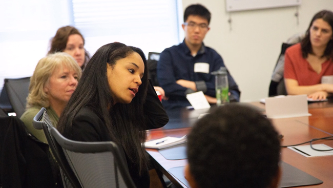 Several Early Career Policy Ambassadors sitting at a conference table at SfN Headquarters.