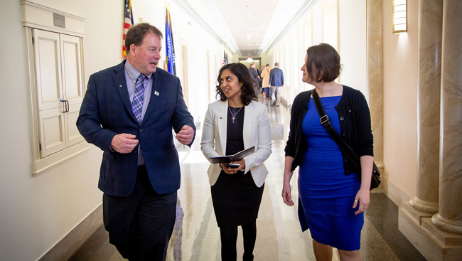 Early Career Policy Ambassadors walk alongside a member of Congress at SfN's Capitol Hill Day 2019