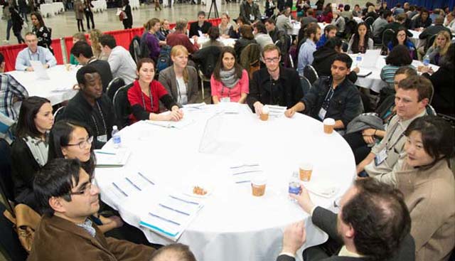A group of mentors and proteges have a round table discussion. 