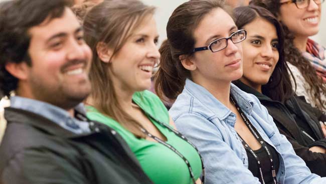 Young male and female neuroscientists smiling