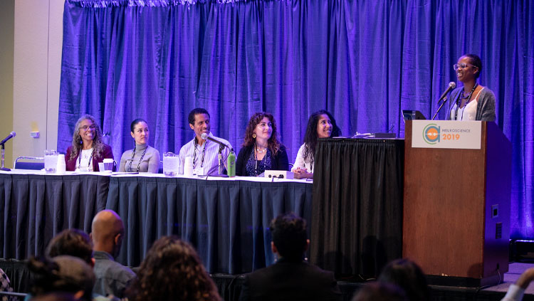 Six Panelists sit at a table for a Neuroscience 2019 Professional Development Workshop.