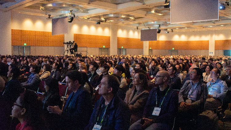 Attendees sitting down during a presentation