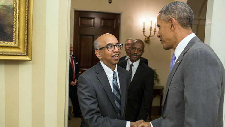 Tilak Ratnanather shakes hands with President Obama.