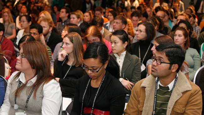 A diverse group of neuroscientists attend a seminar.
