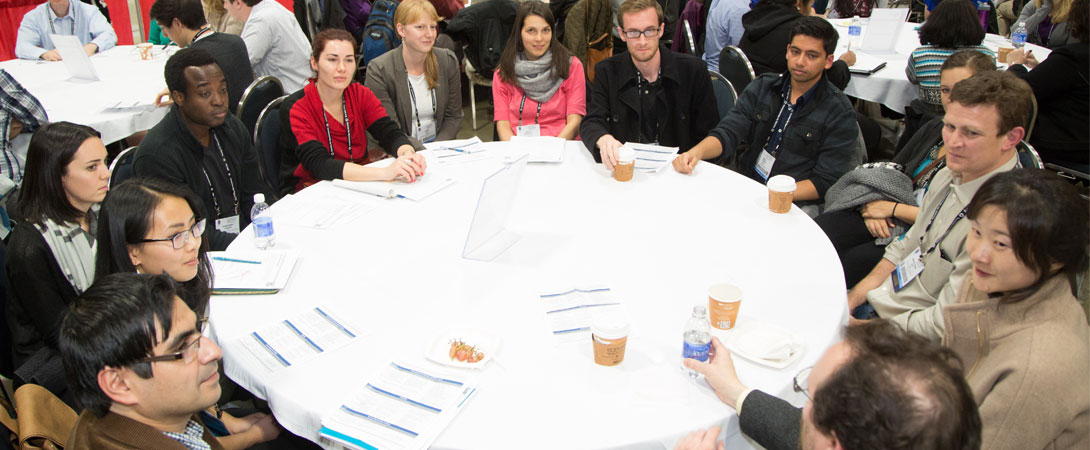 Neuroscientists talk around a table