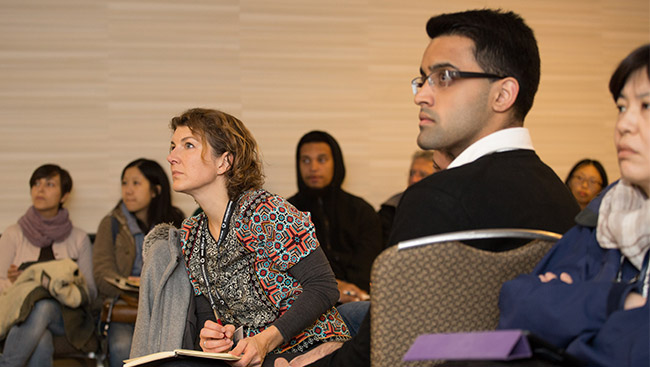 A group of neuroscientists attend a lecture. 