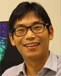 Headshot of Ki-Jun Yoon wearing glasses and a gray collared shirt.