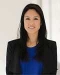 Headshot of Nanthia Suthana wearing a blue shirt with a black jacket.