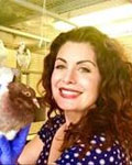 Image of Rebecca Calisi holding a bird.