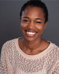 Headshot of Rockelle Guthrie wearing a pink sweater.