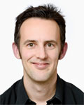Headshot of Tony Southall wearing a black shirt.